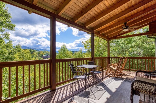 wooden terrace featuring ceiling fan