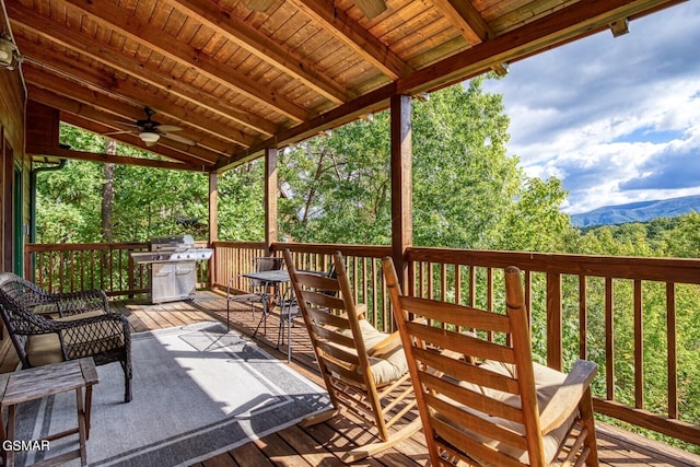 deck with ceiling fan and a grill