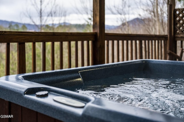 deck featuring a hot tub