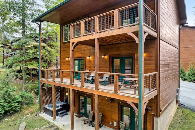 back of house featuring french doors