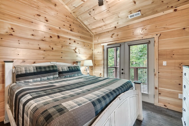 bedroom featuring dark hardwood / wood-style flooring, access to outside, vaulted ceiling, wooden walls, and wooden ceiling