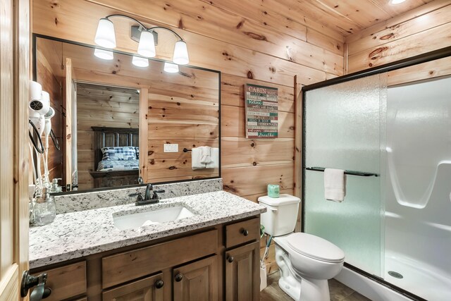 bathroom with an enclosed shower, wood ceiling, vanity, toilet, and wood walls