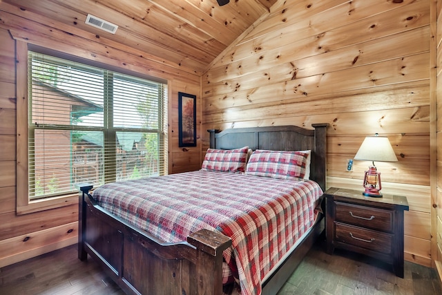 bedroom with lofted ceiling, dark wood-type flooring, wooden walls, and wooden ceiling