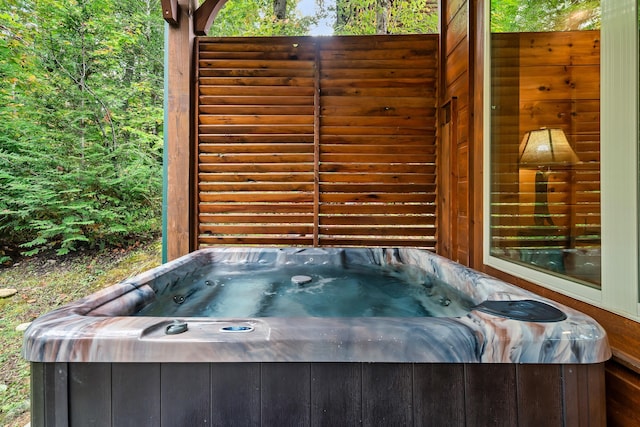 exterior space with a hot tub