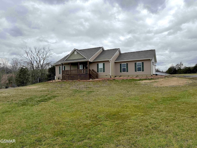 view of front of house with crawl space and a front lawn