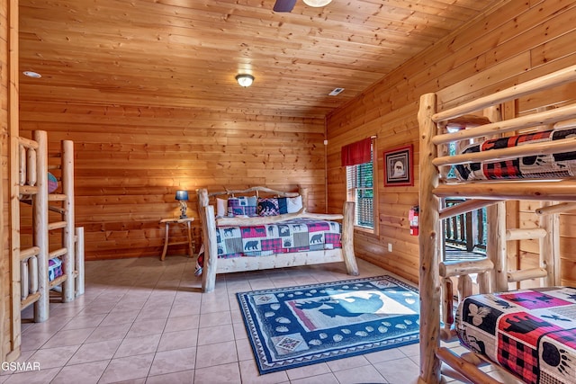 tiled bedroom featuring wooden walls and wood ceiling