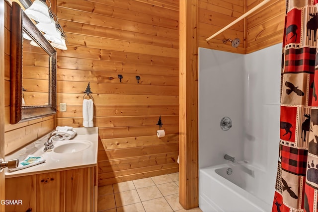 bathroom with tile patterned floors, shower / tub combo, vanity, and wood walls