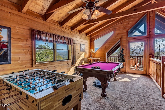 rec room featuring lofted ceiling with beams, plenty of natural light, carpet flooring, and wood walls