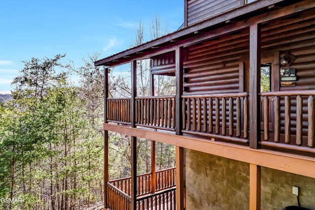 view of side of property with a balcony