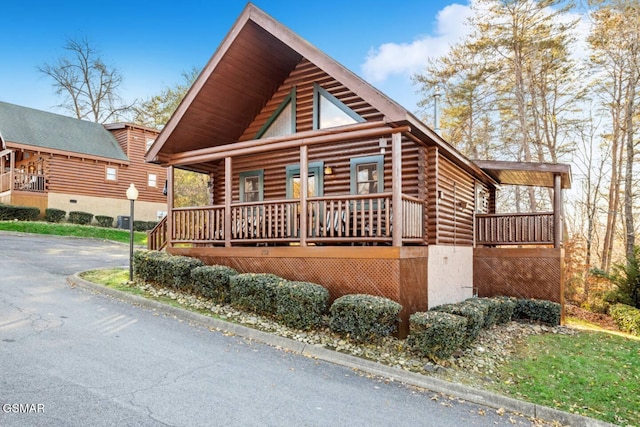232 Moose Ridge Way, Pigeon Forge, TN 37863 - log cabin with log siding and a porch