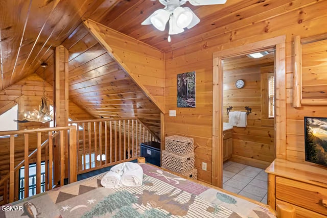 232 Moose Ridge Way, Pigeon Forge, TN 37863 - tiled bedroom with wooden walls, lofted ceiling, and wooden ceiling