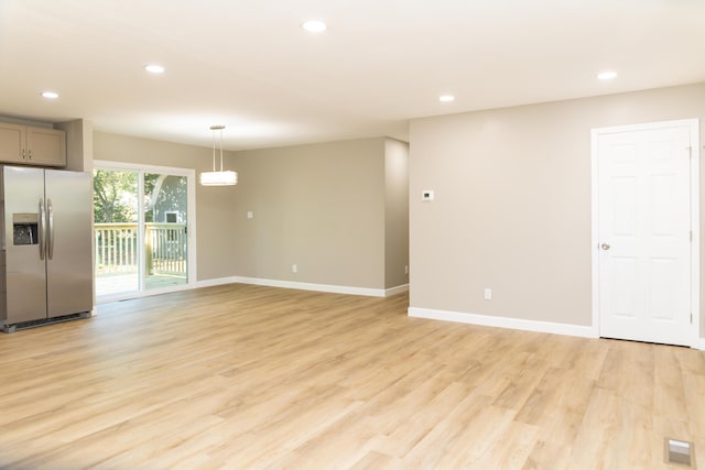 unfurnished living room featuring light hardwood / wood-style flooring