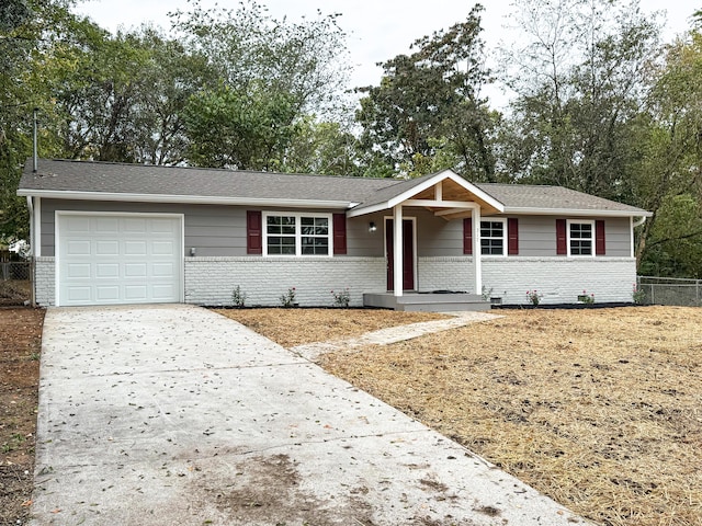 ranch-style house featuring a garage