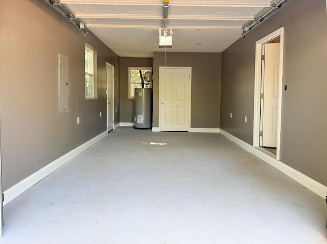 garage featuring electric panel, gas water heater, and a garage door opener