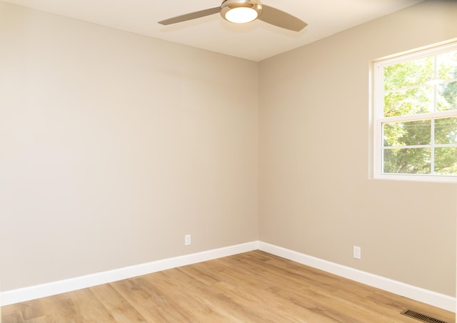 unfurnished room with ceiling fan and light wood-type flooring