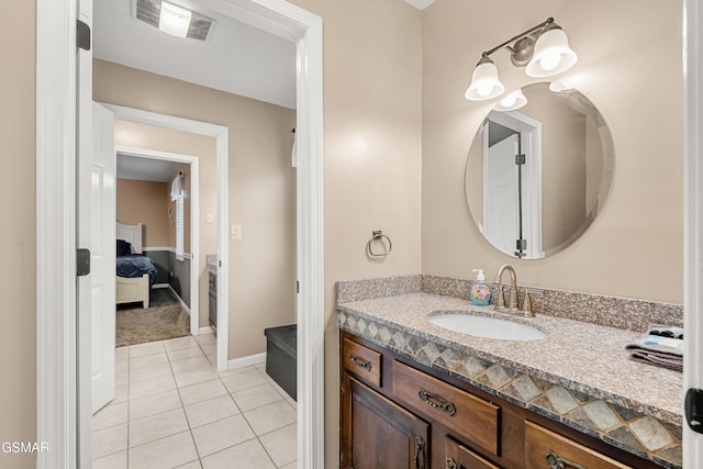 bathroom with vanity and tile patterned flooring