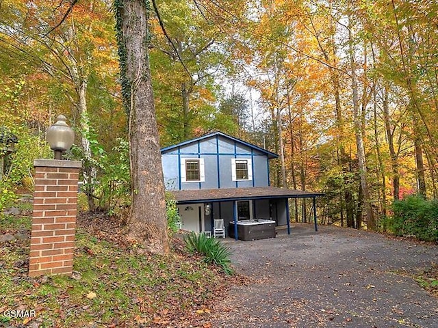 view of front of home with a hot tub