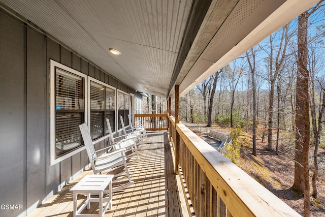 wooden balcony featuring a deck