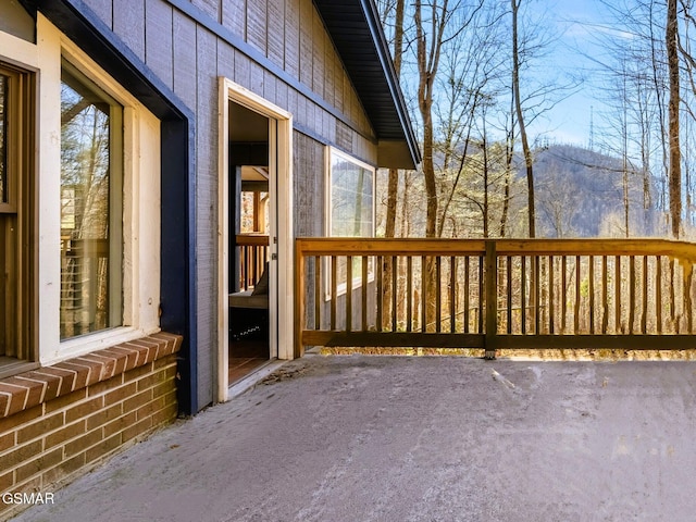 wooden terrace featuring a mountain view