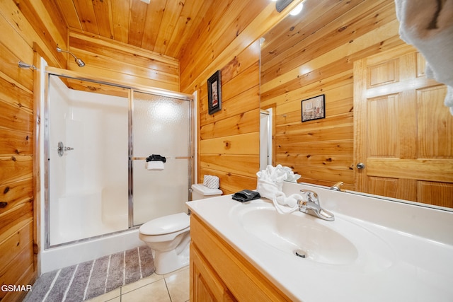 368 Oak Lake Dr, Sevierville, TN 37876 - full bathroom featuring tile patterned flooring, a shower stall, wood walls, vanity, and toilet