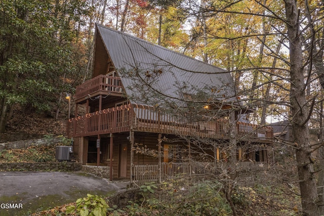 back of house featuring a balcony and central air condition unit