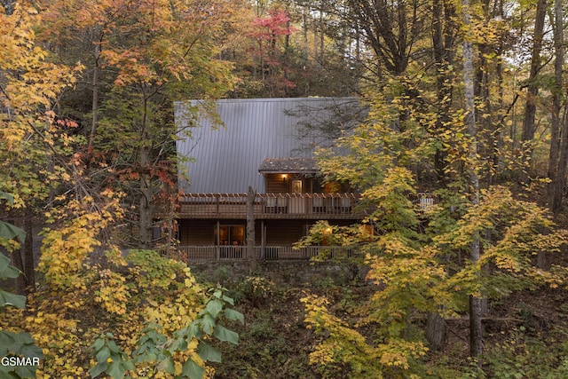 back of house featuring a deck