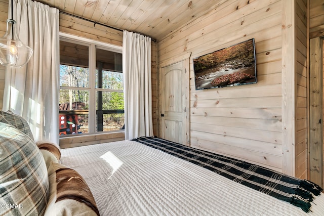 unfurnished bedroom featuring wooden walls and wooden ceiling