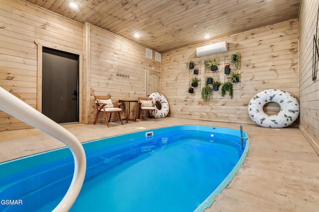 view of pool with a hot tub and a wall unit AC