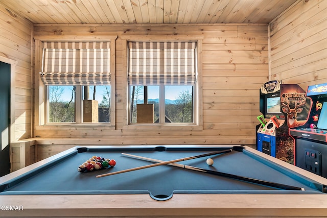 game room featuring wood walls, wood ceiling, and billiards