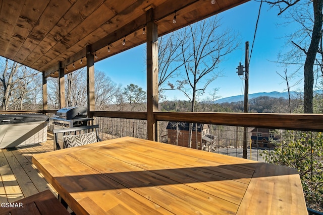 deck featuring a mountain view and grilling area