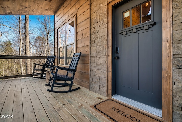 entrance to property featuring a porch