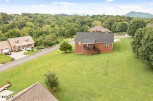 2039 James Rd, Sevierville, TN 37876 - aerial view of property and surrounding area featuring a forest