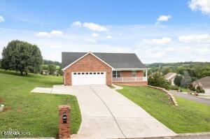 2039 James Rd, Sevierville, TN 37876 - view of front of house with a front lawn, concrete driveway, and an attached garage