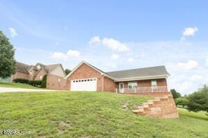 2039 James Rd, Sevierville, TN 37876 - view of front of house featuring a front lawn and a garage