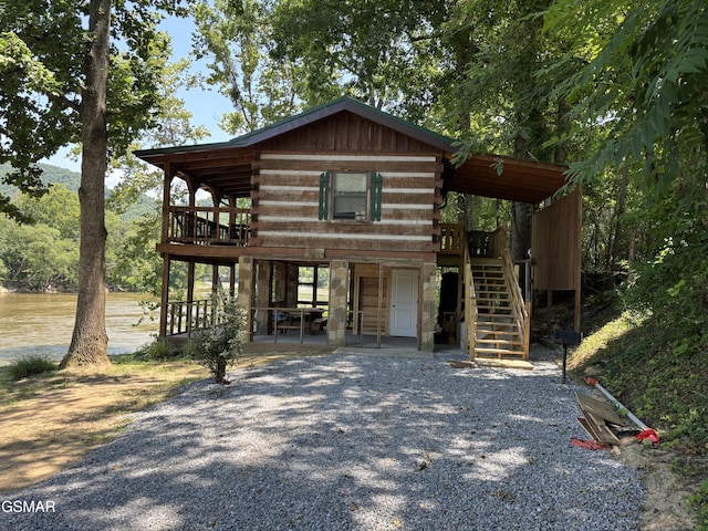864 Fugate Rd, Del Rio, TN 37727 - log cabin with stairway, log siding, and a wooden deck