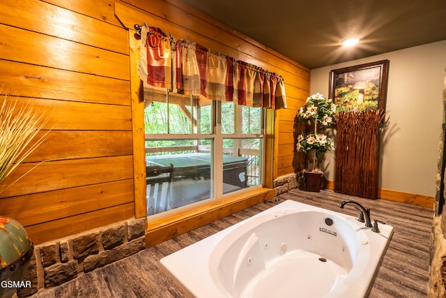 1128 Anastasia Way, Gatlinburg, TN 37738 - full bathroom featuring a jetted tub and wood walls