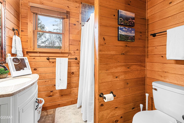 3115 E E Pkwy, Gatlinburg, TN 37738 - bathroom with toilet, wood walls, and vanity