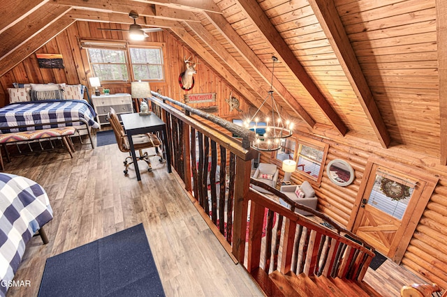 3115 E E Pkwy, Gatlinburg, TN 37738 - interior space featuring lofted ceiling with beams, wooden ceiling, wood finished floors, log walls, and an inviting chandelier