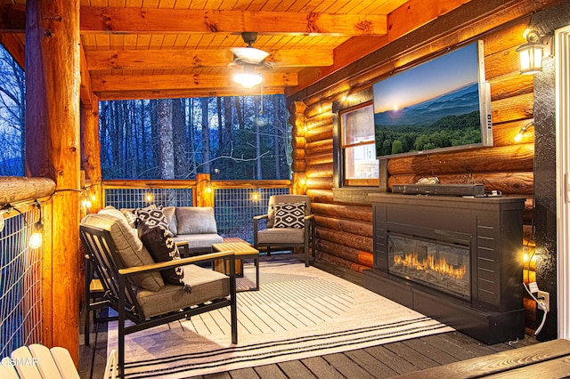 3115 E E Pkwy, Gatlinburg, TN 37738 - interior space featuring a glass covered fireplace, wood ceiling, beamed ceiling, and ceiling fan