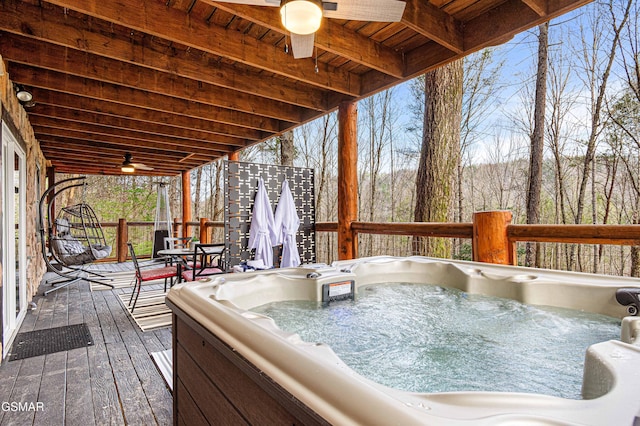 3115 E E Pkwy, Gatlinburg, TN 37738 - deck featuring a hot tub, ceiling fan, and outdoor dining space