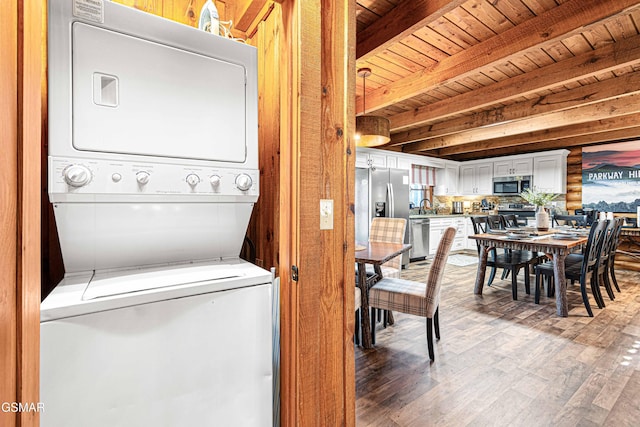 3115 E E Pkwy, Gatlinburg, TN 37738 - laundry room with wooden ceiling, stacked washer and dryer, laundry area, a sink, and wood finished floors