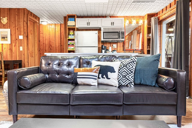 3115 E E Pkwy, Gatlinburg, TN 37738 - living room featuring light wood-type flooring and wooden walls