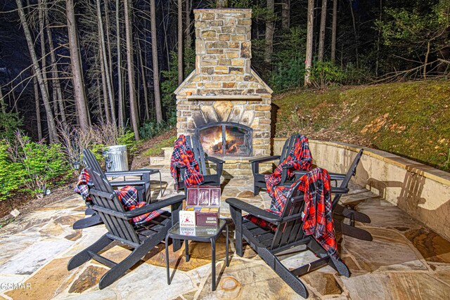 3115 E E Pkwy, Gatlinburg, TN 37738 - view of patio featuring an outdoor stone fireplace