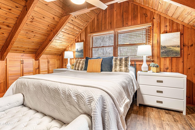 3115 E E Pkwy, Gatlinburg, TN 37738 - bedroom featuring dark wood-style floors, wood ceiling, vaulted ceiling with beams, and wooden walls