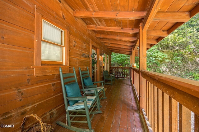 wooden terrace with a porch