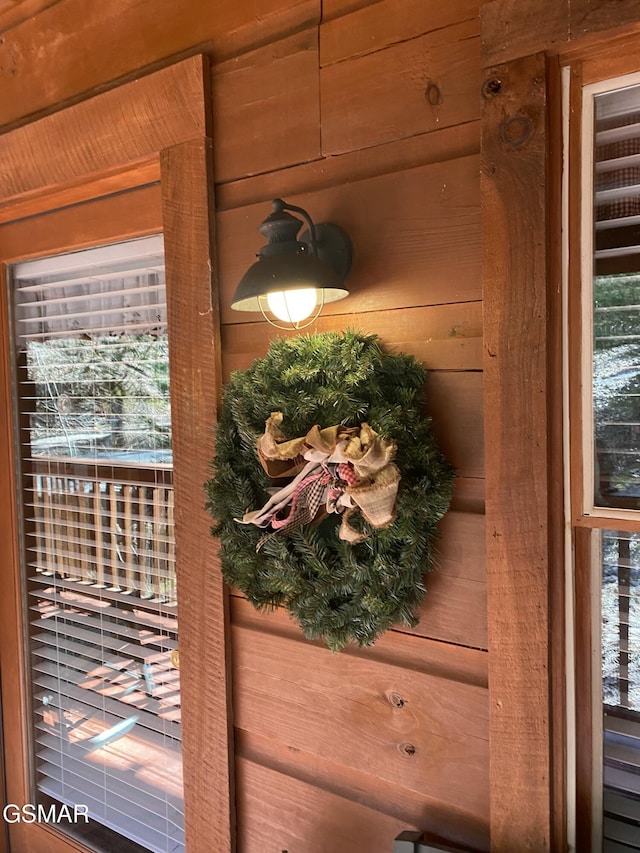 entryway with wooden walls