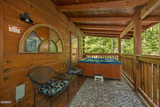 exterior space featuring a porch and a hot tub