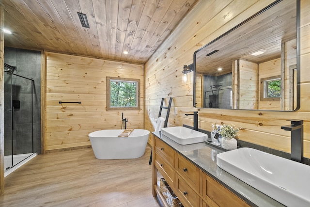 bathroom with wood walls, wood-type flooring, wood ceiling, and plus walk in shower