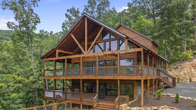 back of house featuring a deck