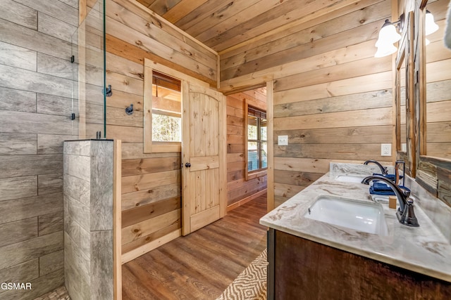 2862 Indigo Ln, Sevierville, TN 37862 - full bathroom with tiled shower, wood walls, wood finished floors, vanity, and wooden ceiling